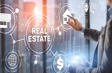 man pushing animated button relating to real estate