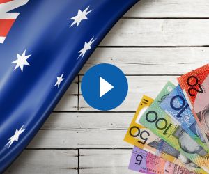 Australian flag and currency on a wooden table