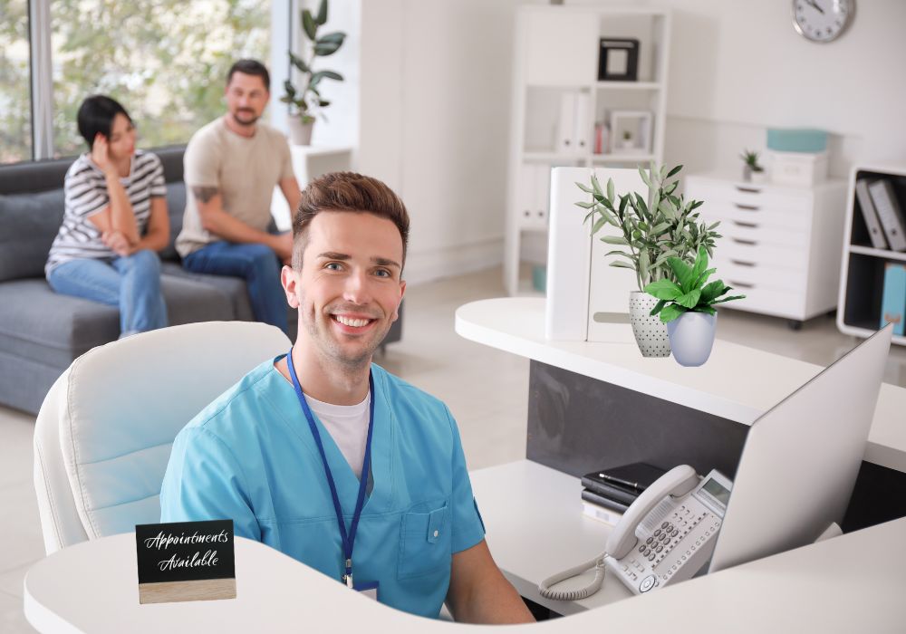 Doctor sitting at the front desk of his medical office desk smiling at the camera, there are patients in the background and the office is modern.